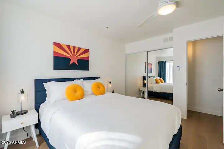 3600 North Hayden Road, Unit 3410 Scottsdale, AZ 85251 - Photo 6 of 22 a bedroom with a bed and wall paintings