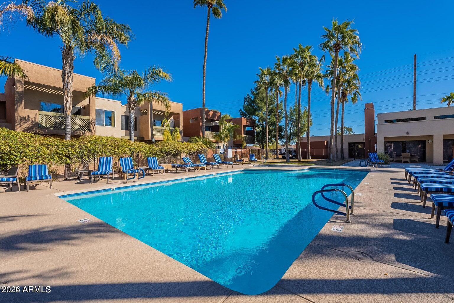 3600 North Hayden Road, Unit 3410 Scottsdale, AZ 85251 - Photo 10 of 22 a view of a swimming pool with a lounge chairs