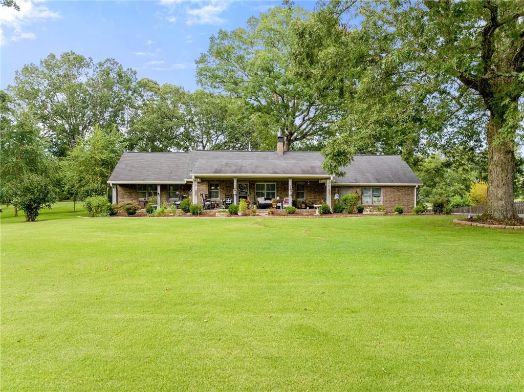 5236 Clarks Bridge Road Gainesville, GA 30506 - Photo 1 of 1 a front view of a house with yard porch and patio