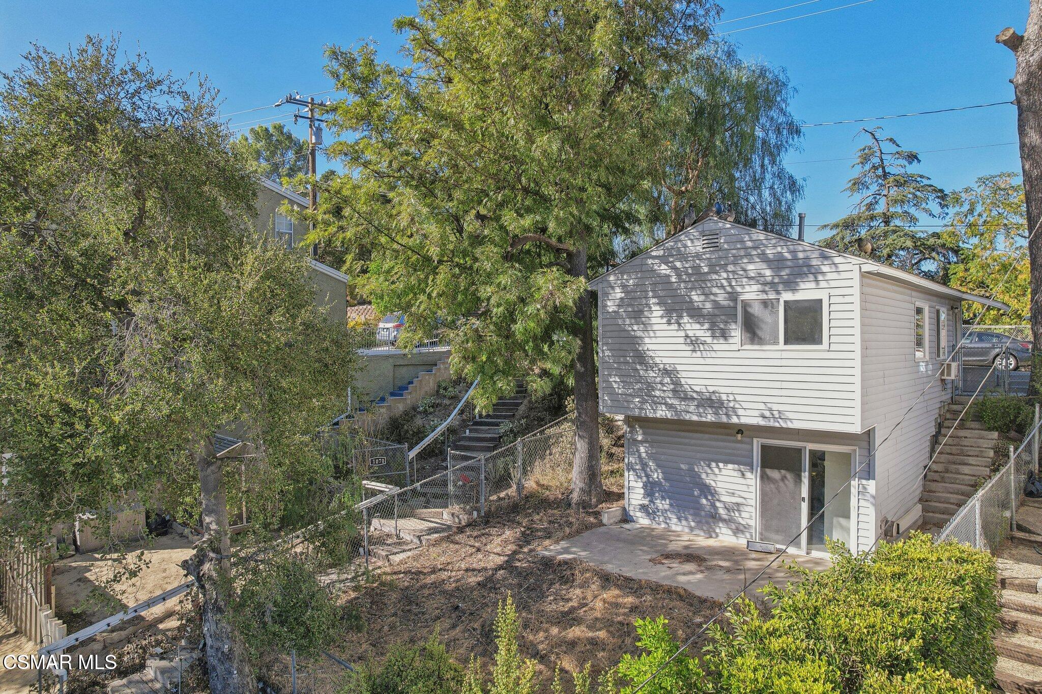 1068 Alta Vista Road Simi Valley, CA 93063 - Photo 12 of 16 a view of a house with a yard