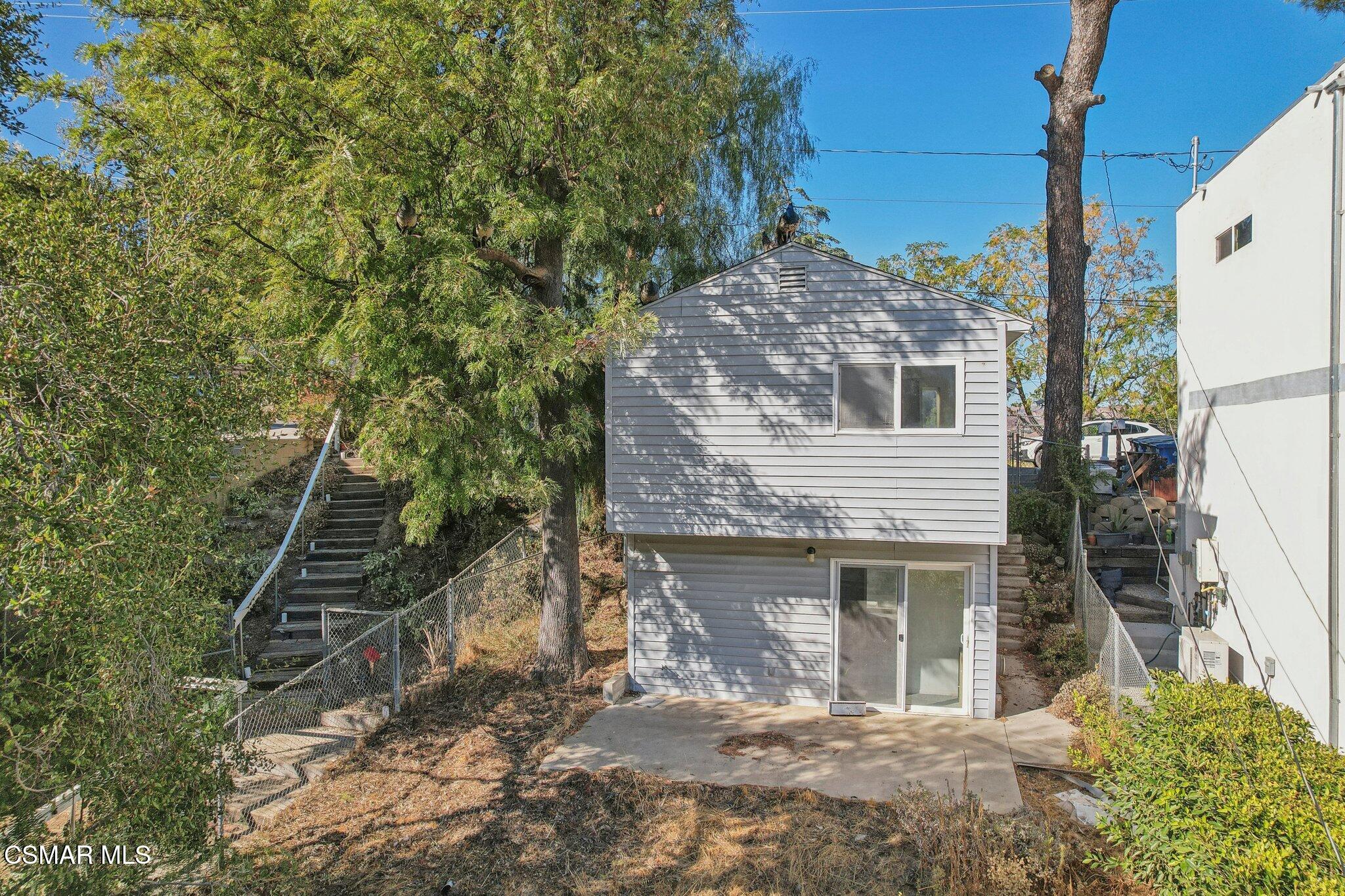 1068 Alta Vista Road Simi Valley, CA 93063 - Photo 16 of 16 a view of a house with a yard