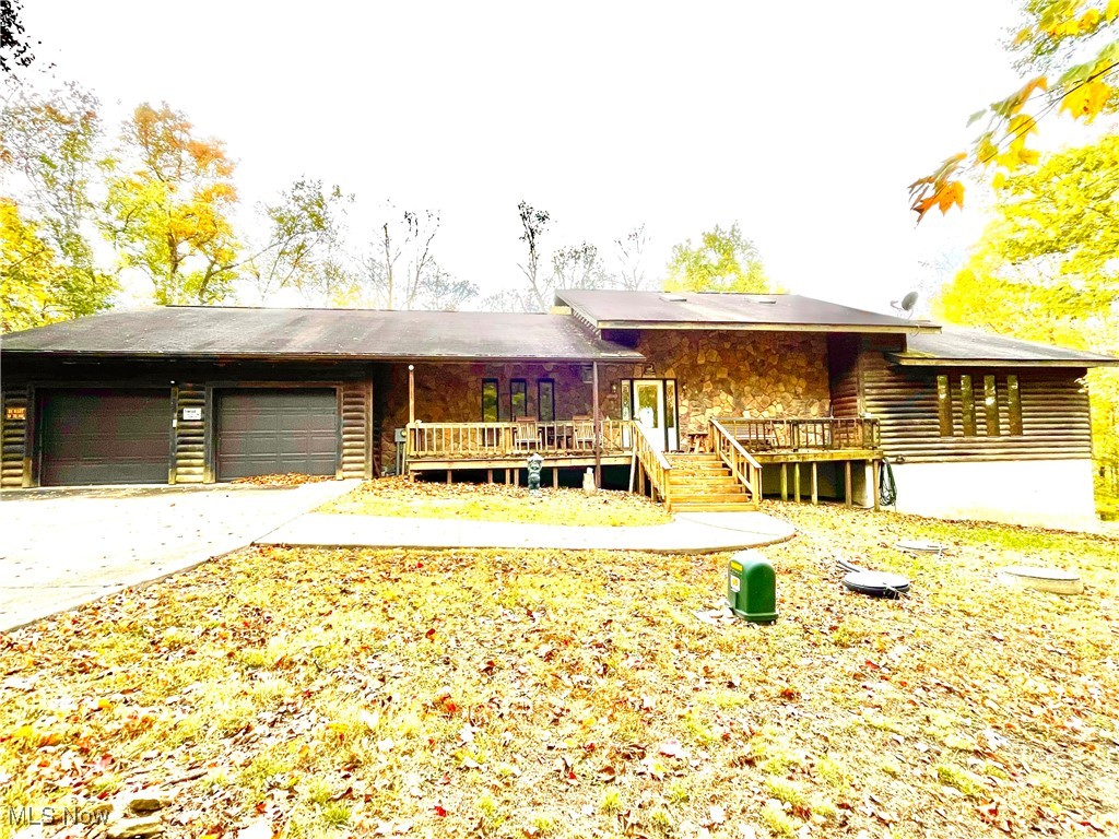 74068 Lake Ridge Road Piedmont, OH 43983 - Photo 1 of 45 View of front of home with a garage and a wooden deck