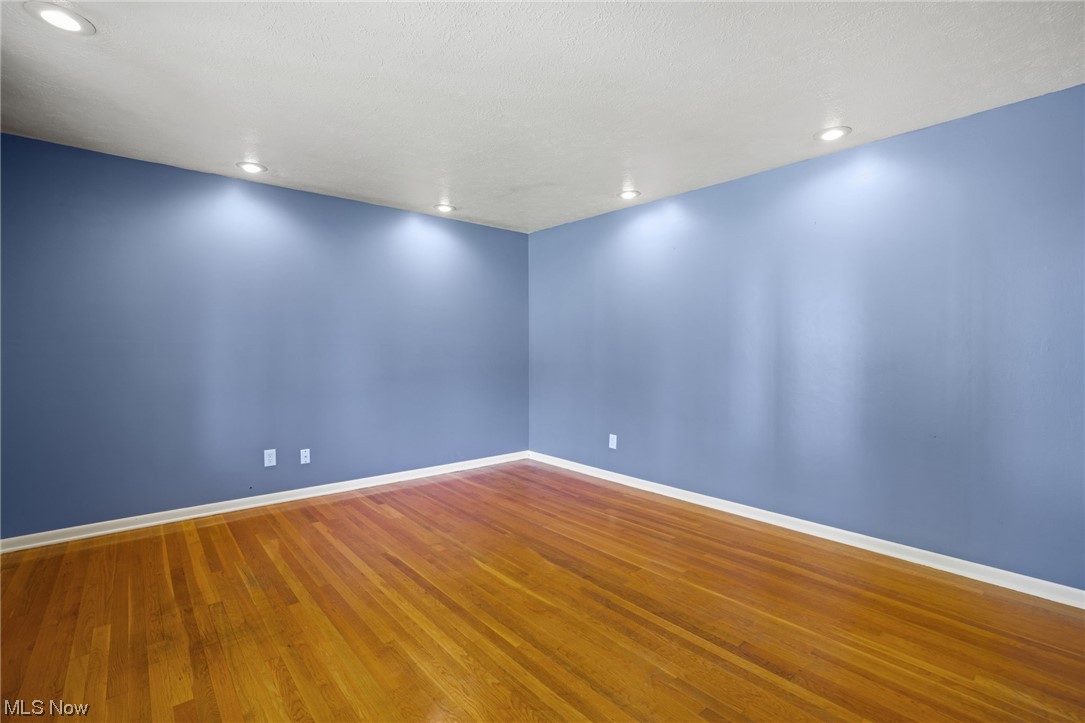 730 East Nimisila Road Uniontown, OH 44685 - Photo 7 of 25 Empty room featuring hardwood / wood-style flooring