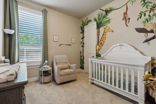 a bedroom with furniture and a window