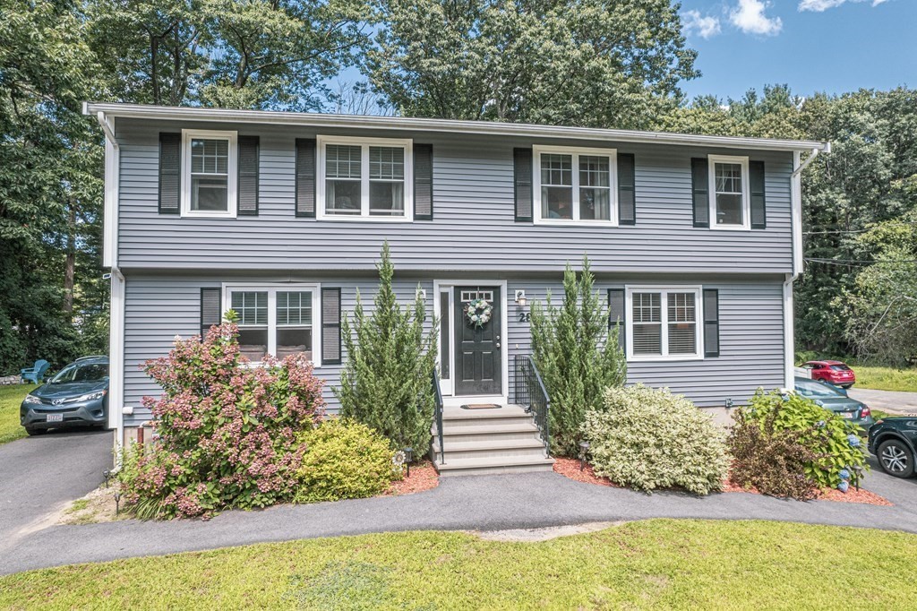 28 Pondover Road, Unit 28 Billerica, MA 01821 - Photo 1 of 4 a front view of a house with garden
