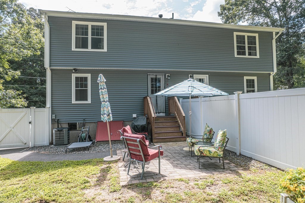 28 Pondover Road, Unit 28 Billerica, MA 01821 - Photo 2 of 4 a view of a house with backyard and sitting area