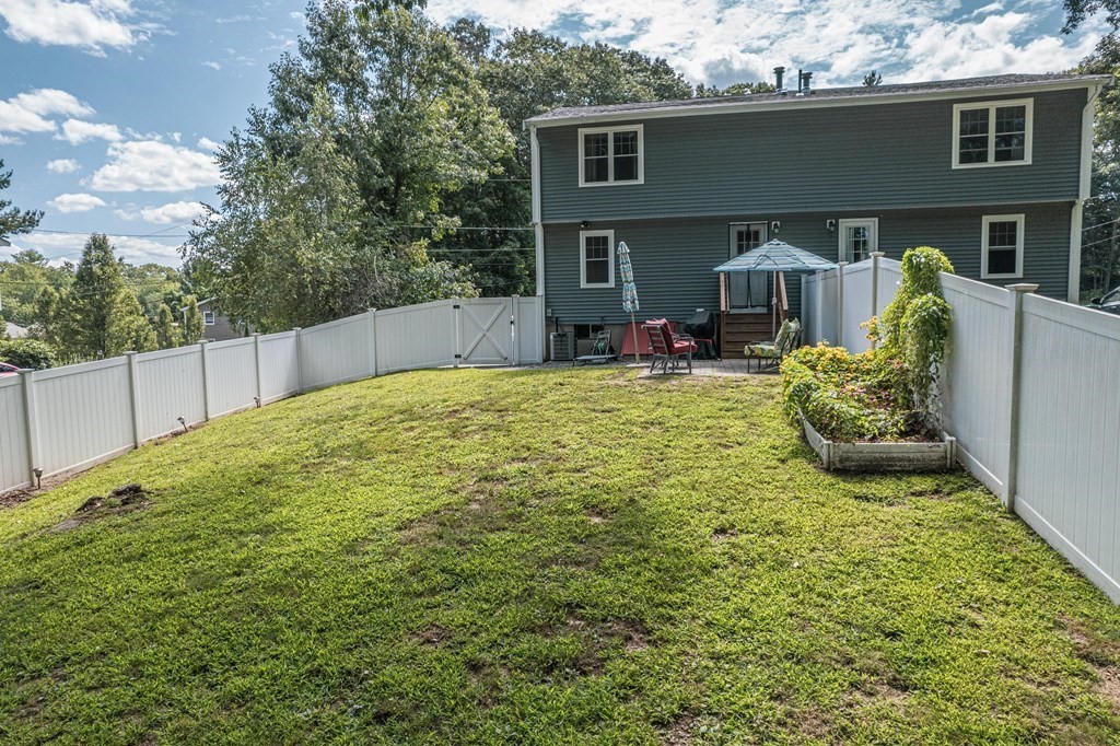 28 Pondover Road, Unit 28 Billerica, MA 01821 - Photo 3 of 4 a view of a house with backyard and sitting area