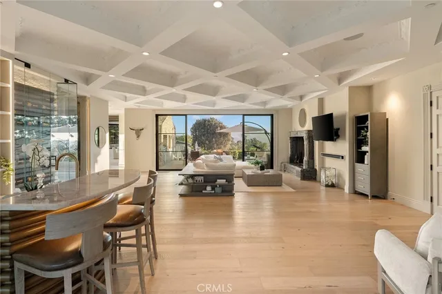 a living room with furniture flat screen tv and a fireplace