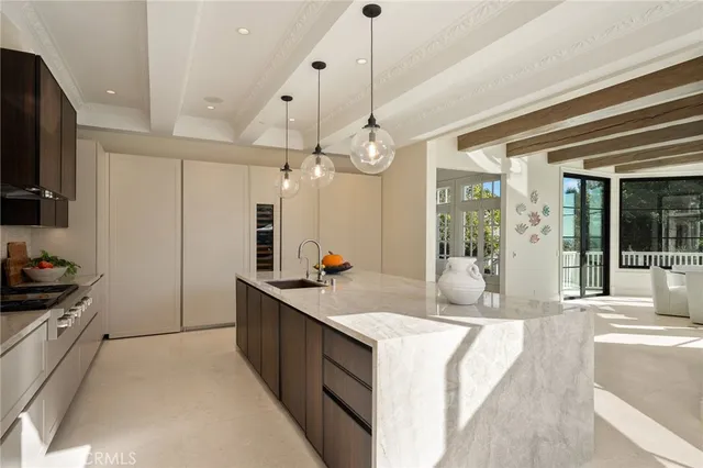 a living room with furniture and large windows