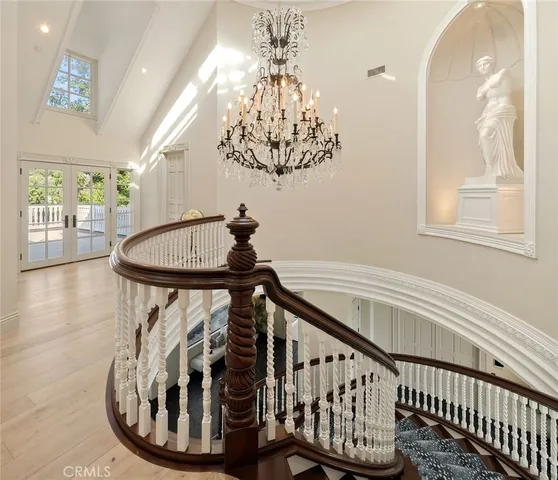 a bedroom with a bed and a book shelf