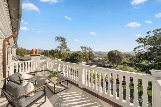 a front view of a house with swimming pool and a yard
