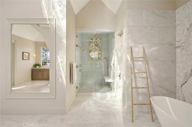 a view of a house with backyard swimming pool and sitting area