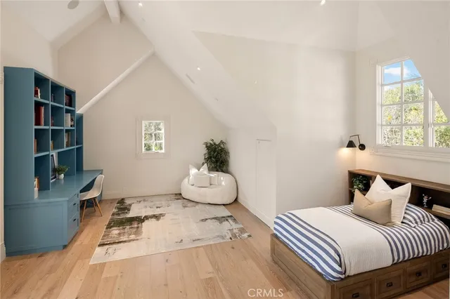 a living room with furniture and floor to ceiling windows