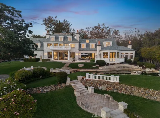a view of a building with a yard patio and fire pit