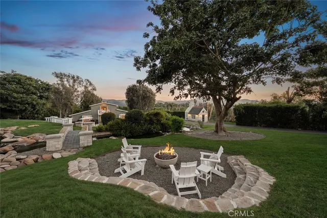 a spacious bedroom with a bed and a flat screen tv
