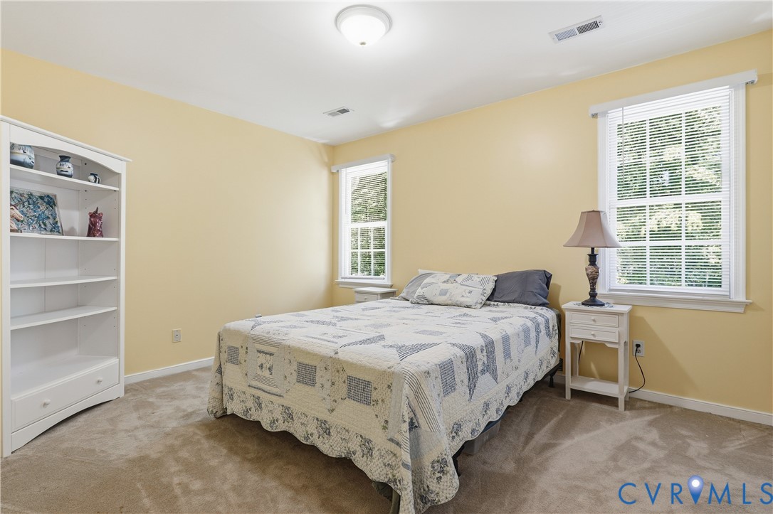 12512 2nd Branch Road Chesterfield, VA 23838 - Photo 35 of 56 a bedroom with a bed and a window