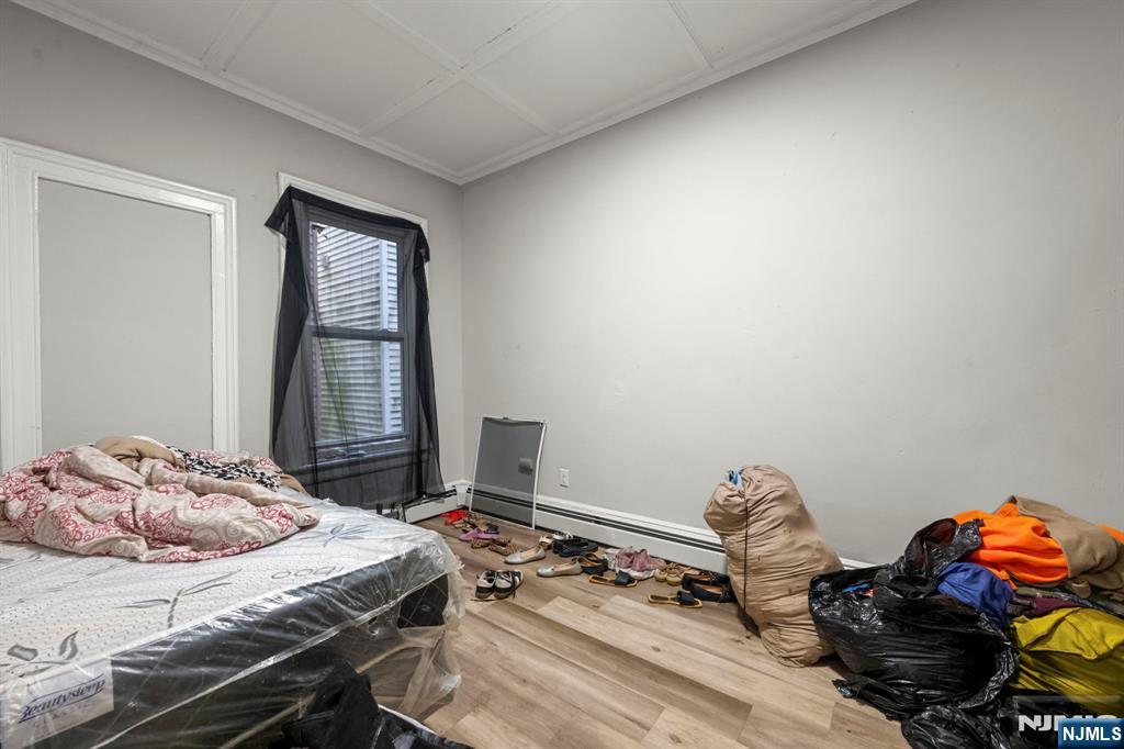 282 Hamilton Avenue Paterson, NJ 07501 - Photo 16 of 21 a bedroom with a bed and a window