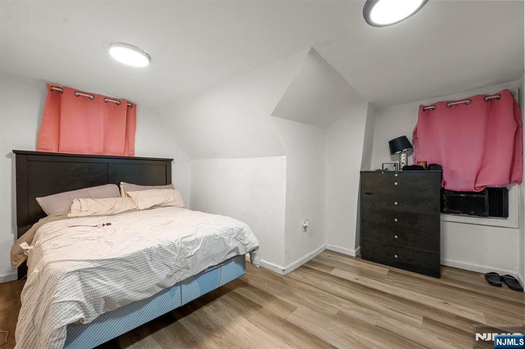 282 Hamilton Avenue Paterson, NJ 07501 - Photo 20 of 21 a bedroom with a bed and a closet