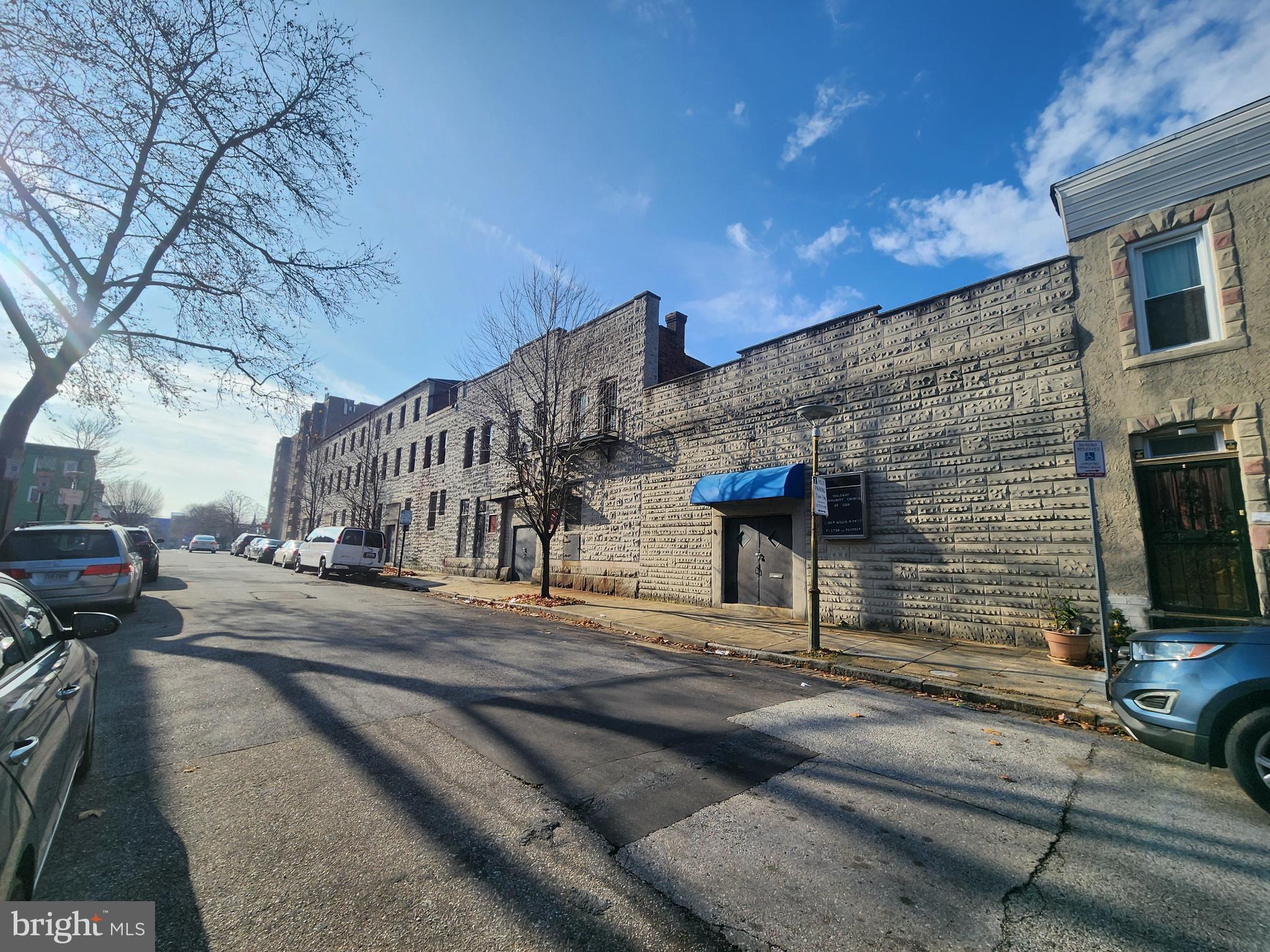 404 South Castle Street Baltimore, MD 21231 - Photo 3 of 3 a view of a street with cars on road