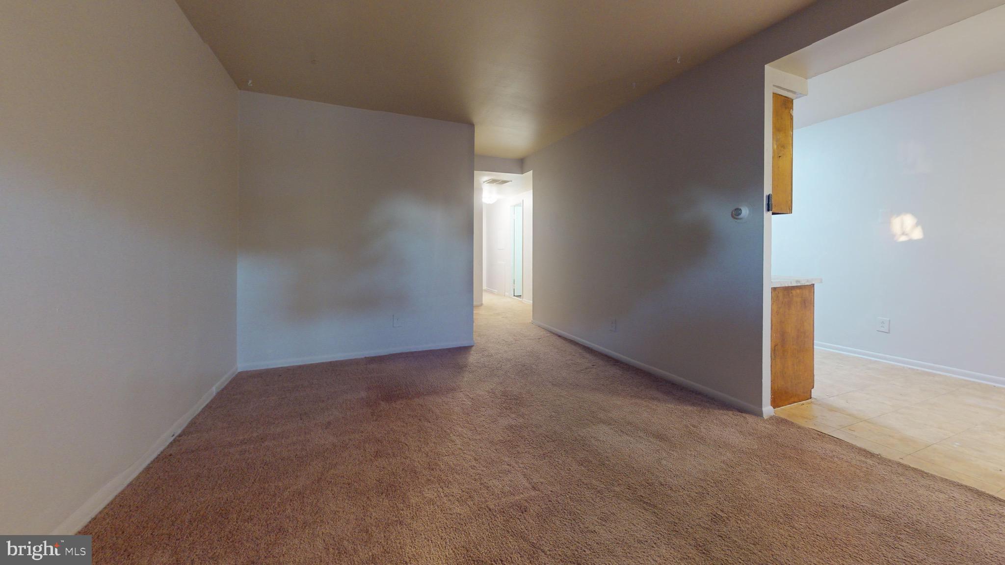 717 Red Lion Road, Unit 1 Philadelphia, PA 19116 - Photo 3 of 9 an empty room with windows