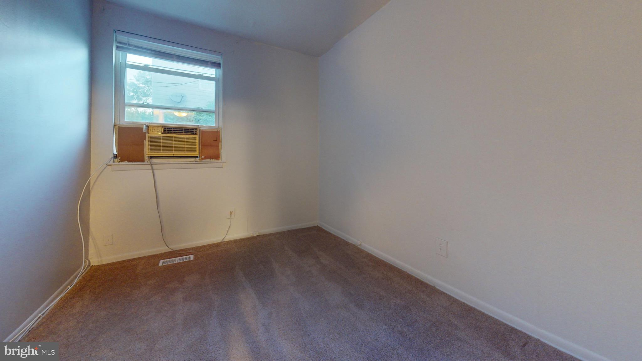 717 Red Lion Road, Unit 1 Philadelphia, PA 19116 - Photo 5 of 9 a view of an empty room with a window