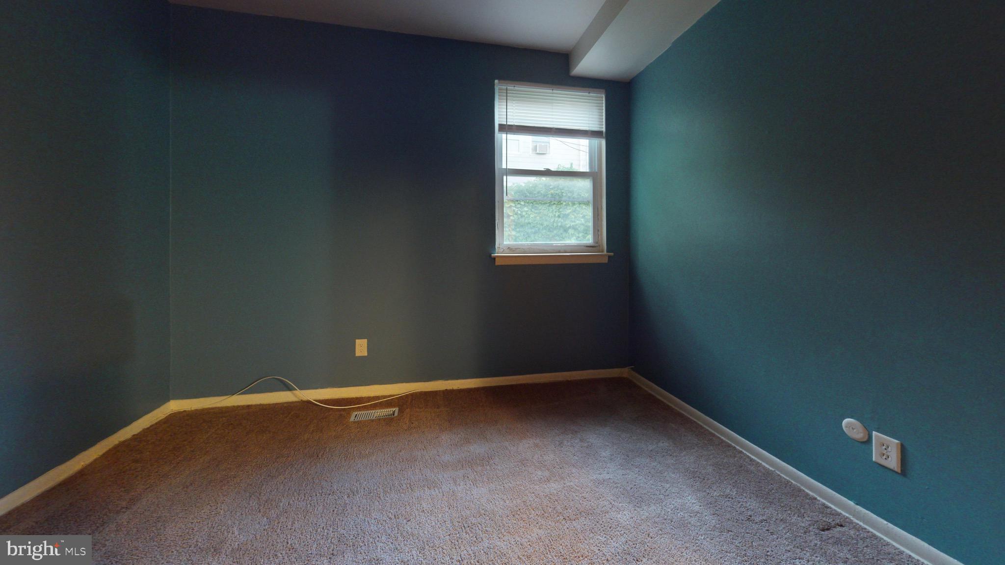 717 Red Lion Road, Unit 1 Philadelphia, PA 19116 - Photo 8 of 9 a view of an empty room with a window