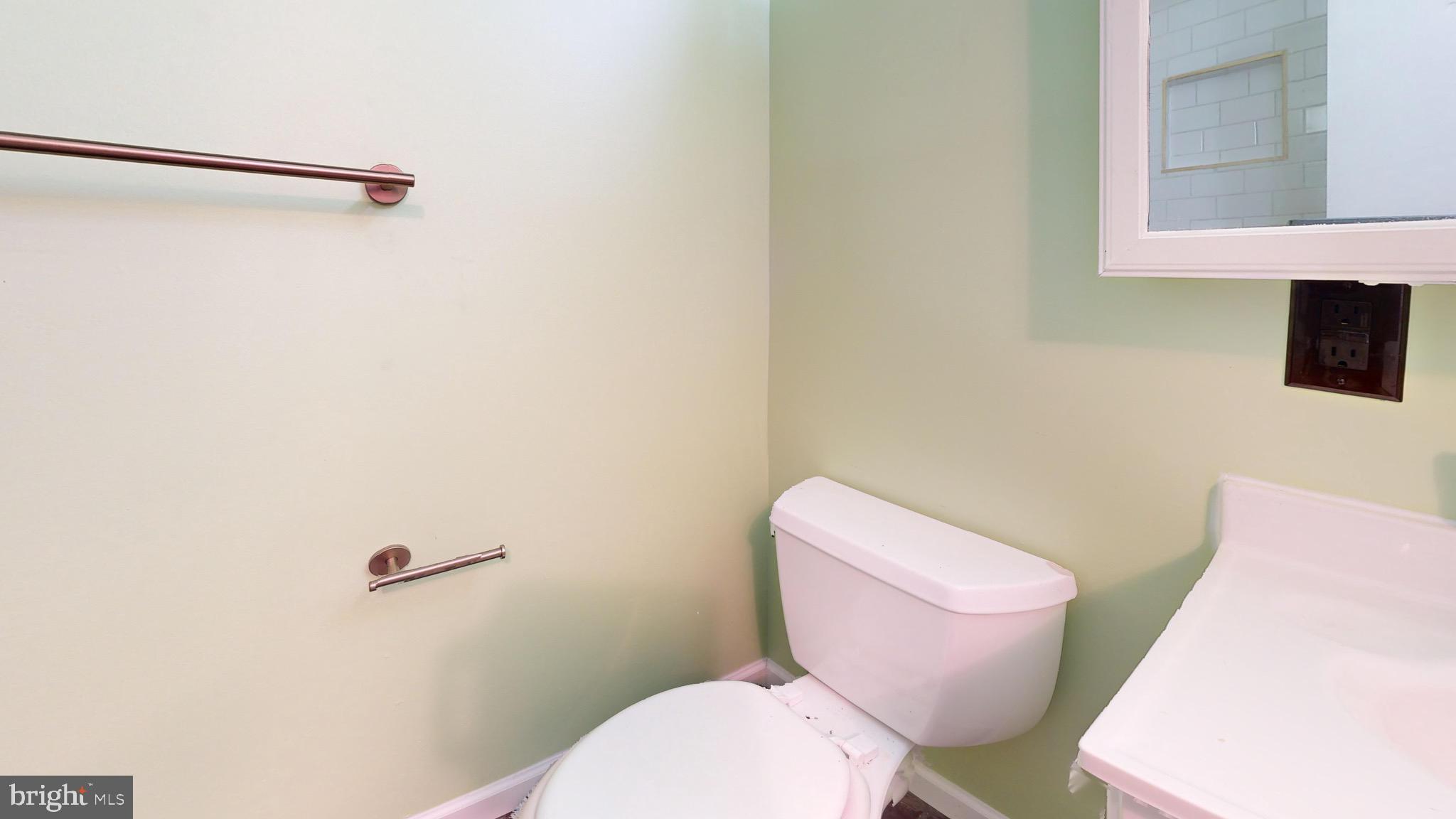 717 Red Lion Road, Unit 1 Philadelphia, PA 19116 - Photo 9 of 9 a white toilet sitting next to a bathroom sink