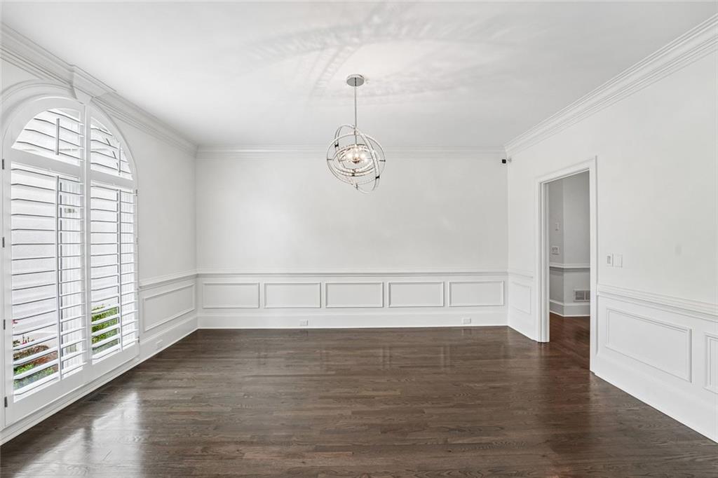 1091 Fieldstone Trail Milton, GA 30004 - Photo 24 of 84 a view of an empty room with wooden floor and a window