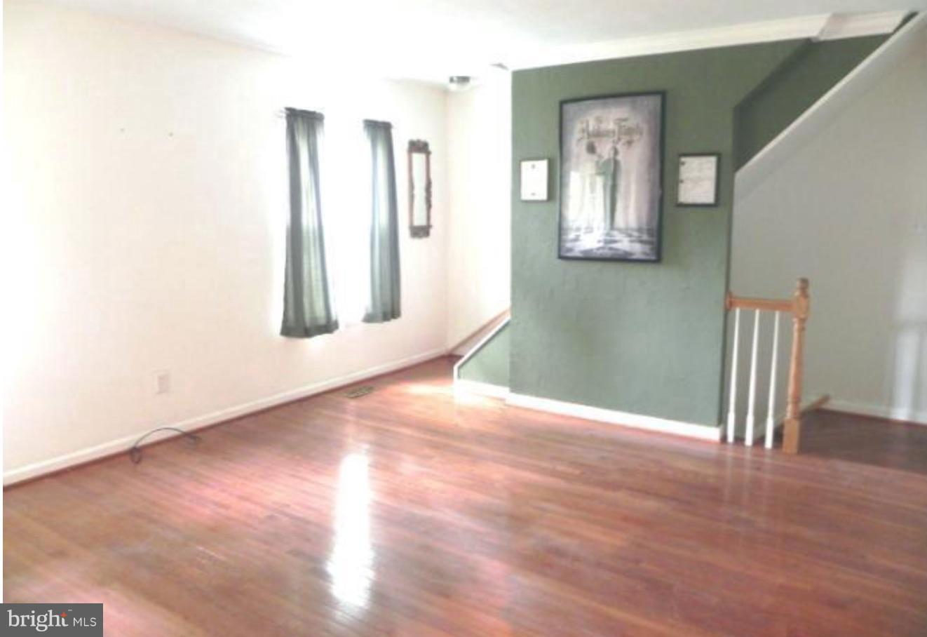 74 Ridgelawn Road, Unit A Reisterstown, MD 21136 - Photo 4 of 13 Bright Living Room with beautiful floors!