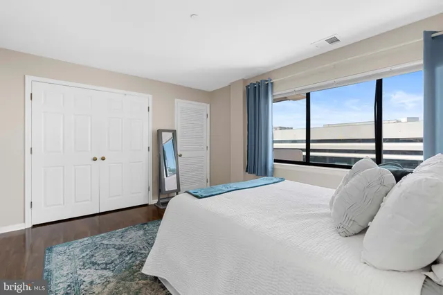 a bedroom with a bed and a dresser