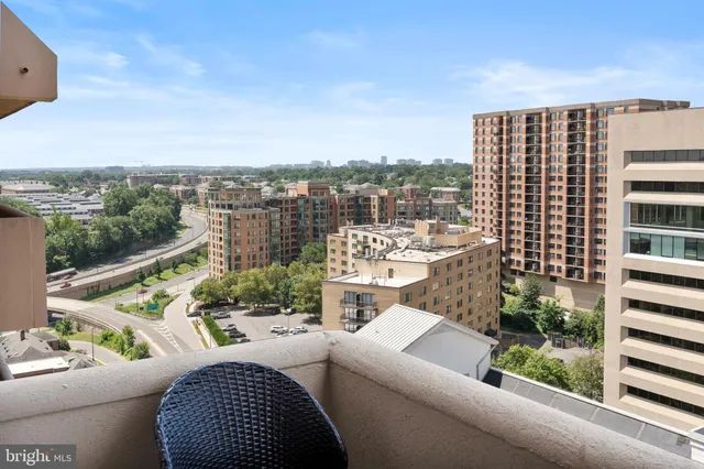 a view of a balcony with furniture