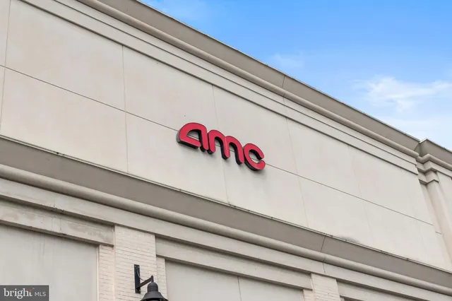 a view of a building with sitting area