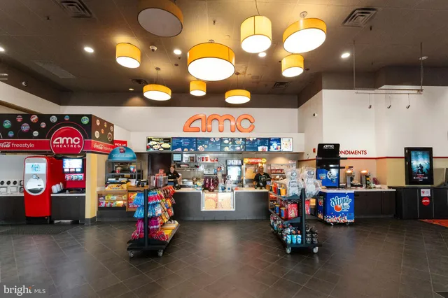 a view of a chairs and table in backyard