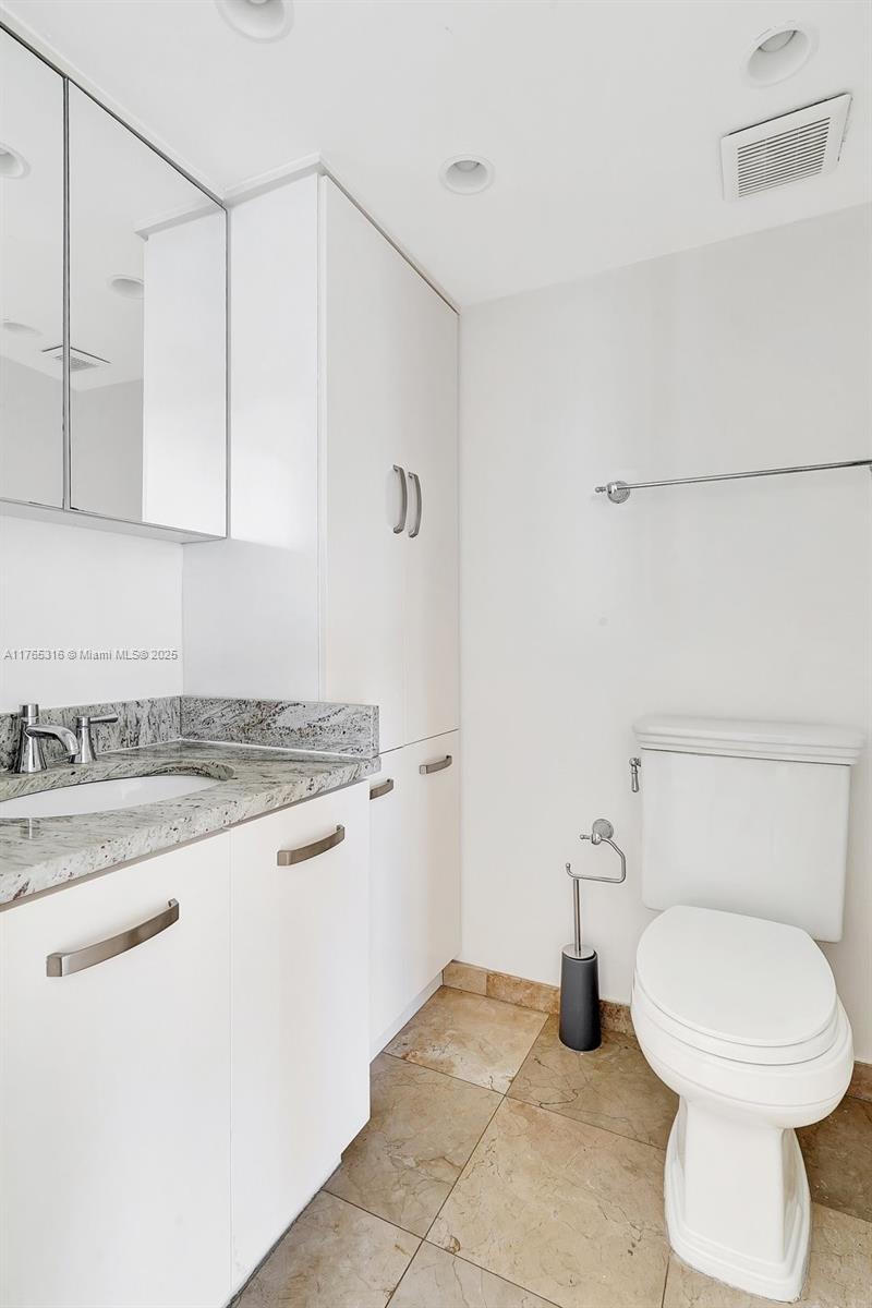 8911 Collins Avenue, Unit 605 Surfside, FL 33154 - Photo 27 of 46 Half Bathroom