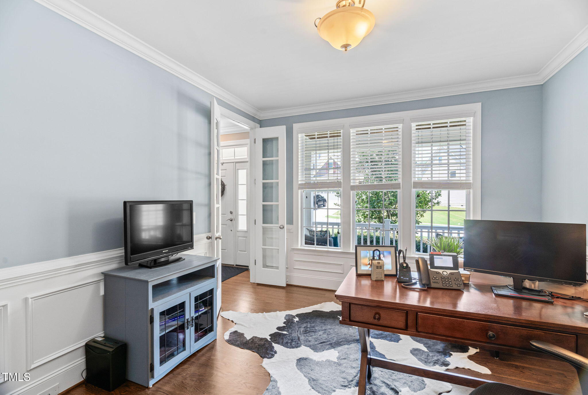 2712 Lake Waccamaw Trail Apex, NC 27502 - Photo 13 of 41 a living room with furniture and a flat screen tv