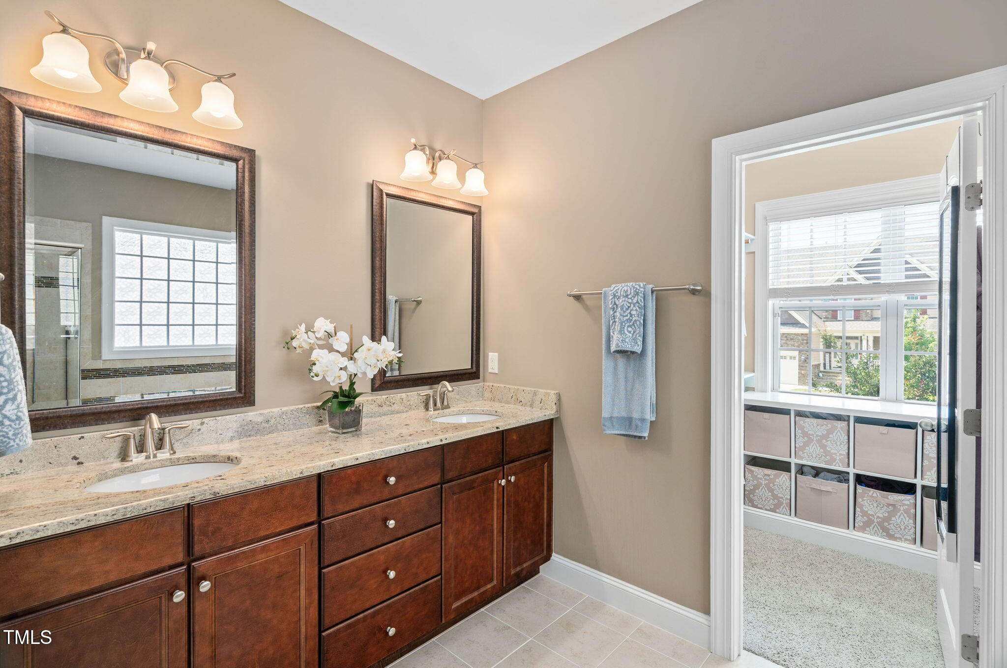 2712 Lake Waccamaw Trail Apex, NC 27502 - Photo 16 of 41 a bathroom with 2 sink tub and a mirror