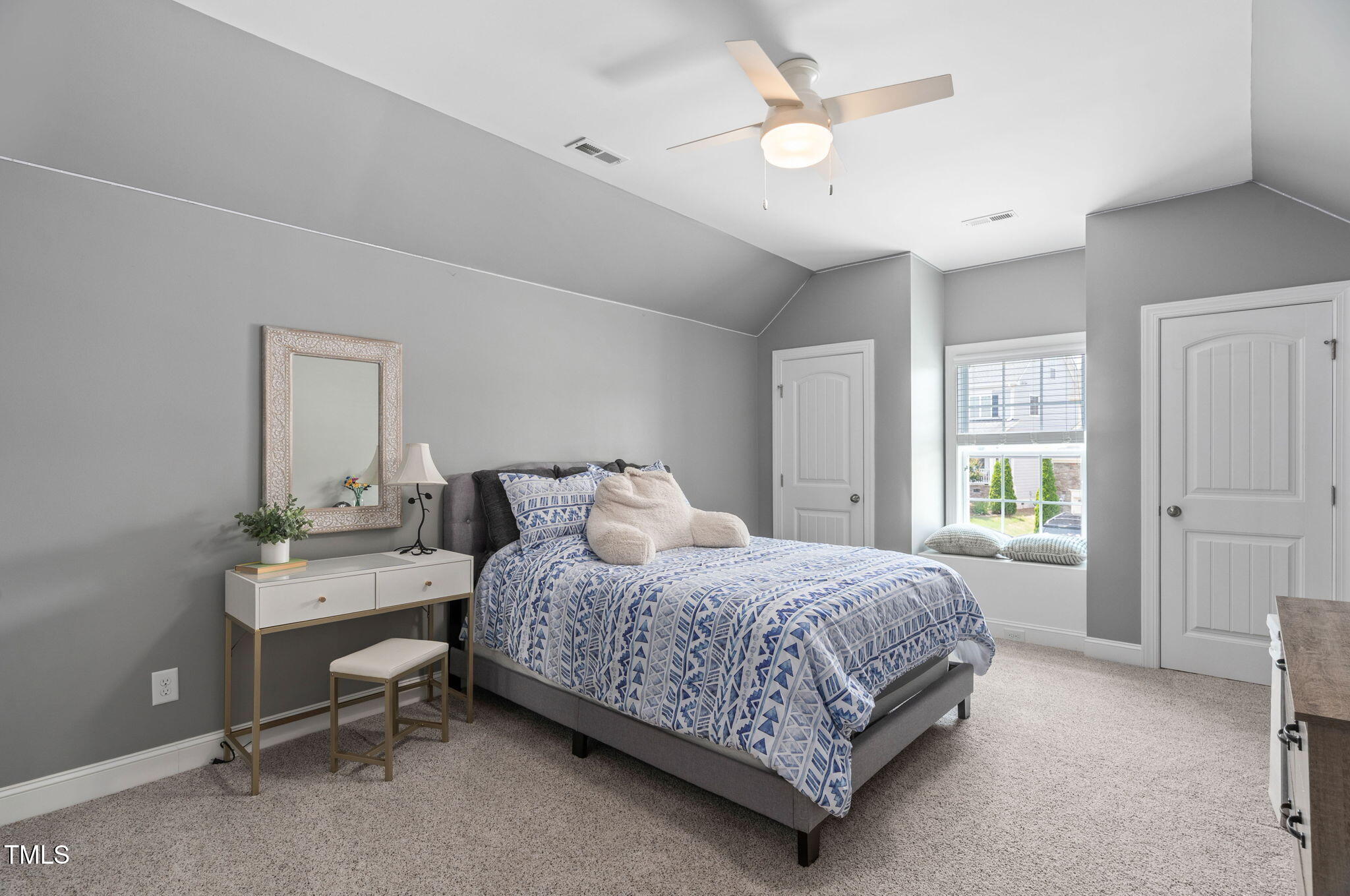 2712 Lake Waccamaw Trail Apex, NC 27502 - Photo 19 of 41 a bedroom with a bed and a table