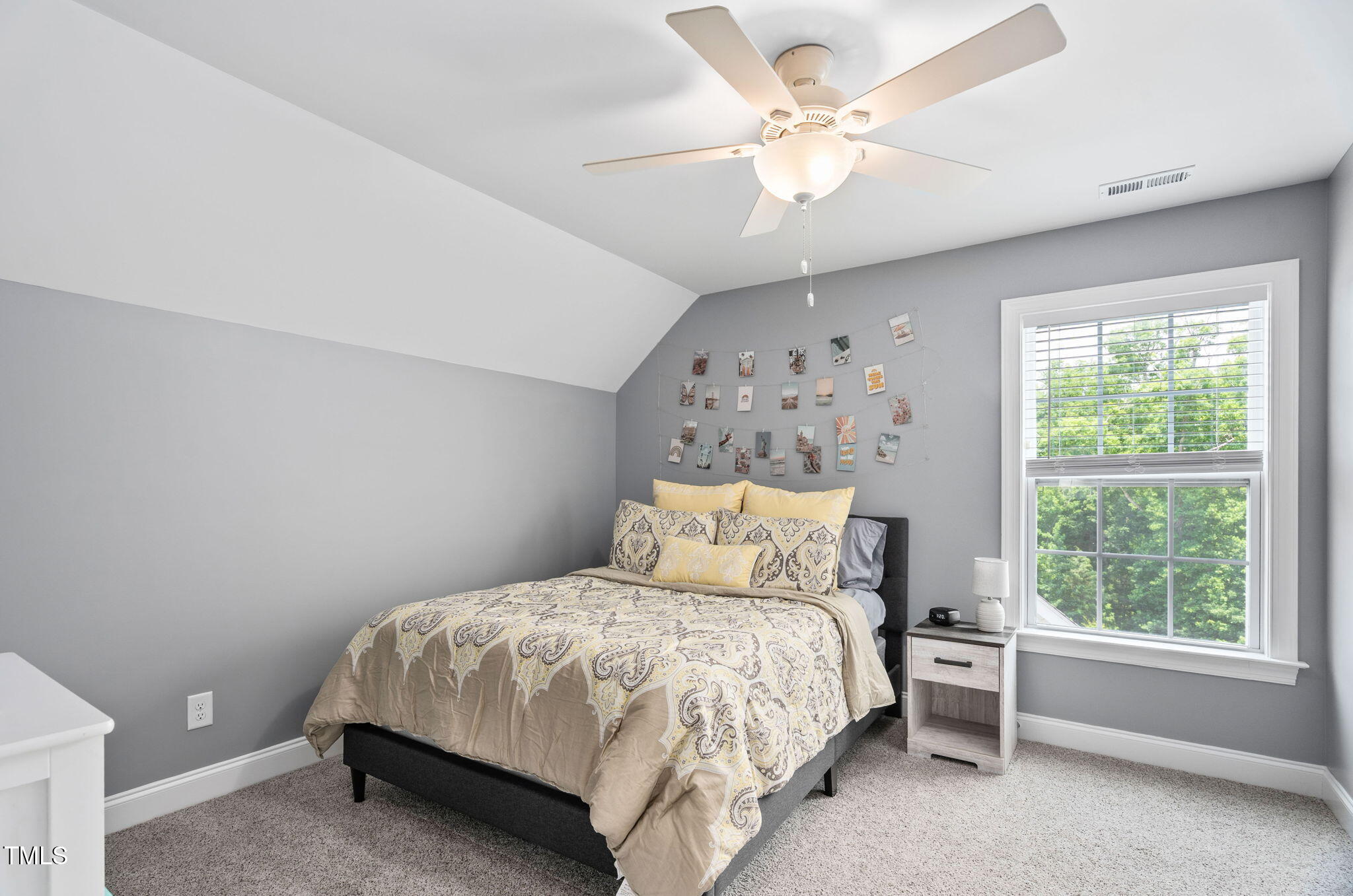 2712 Lake Waccamaw Trail Apex, NC 27502 - Photo 22 of 41 a bed sitting in a bedroom next to a window