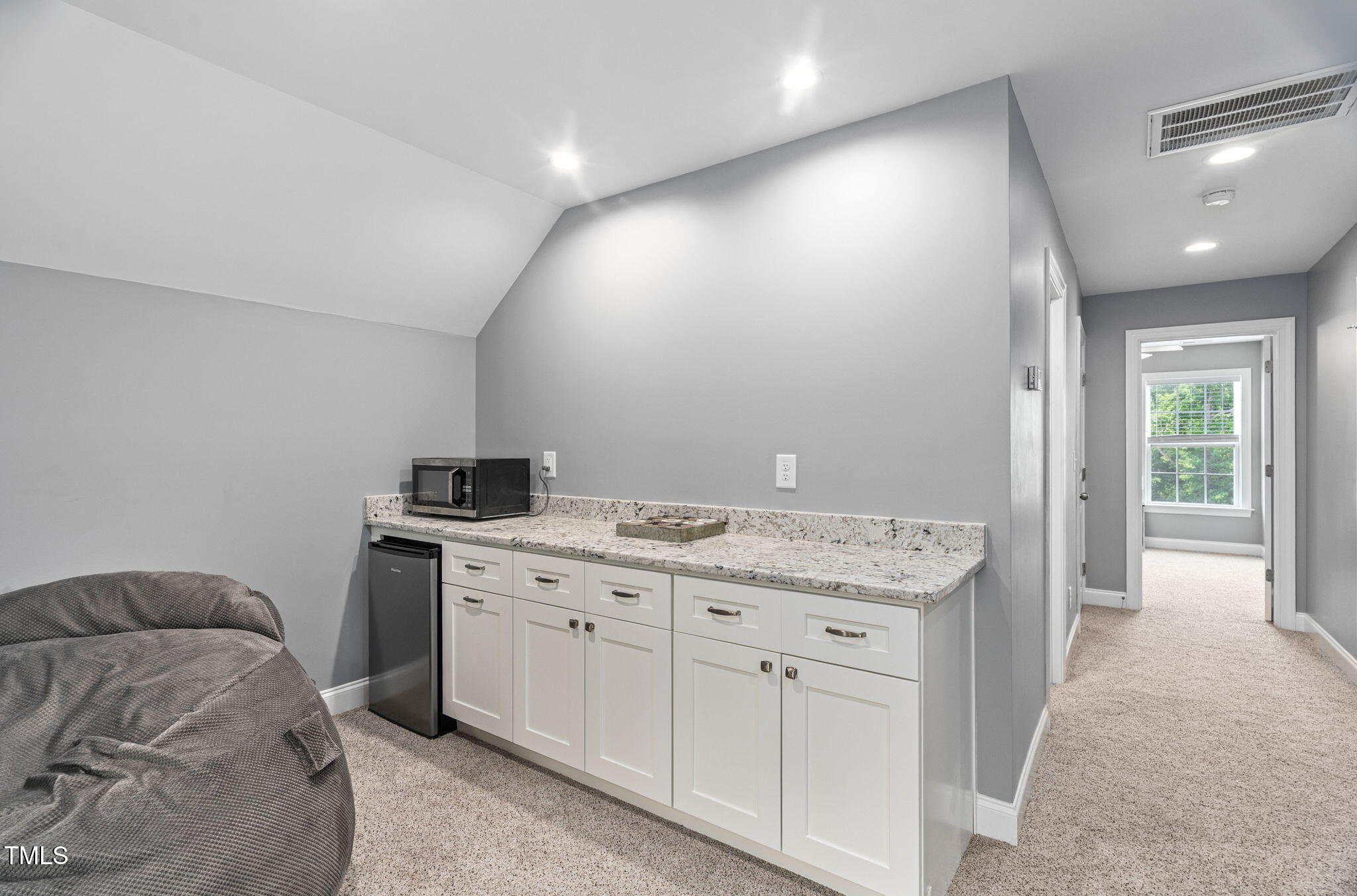2712 Lake Waccamaw Trail Apex, NC 27502 - Photo 24 of 41 a spacious bathroom with a granite countertop sink a vanity and a