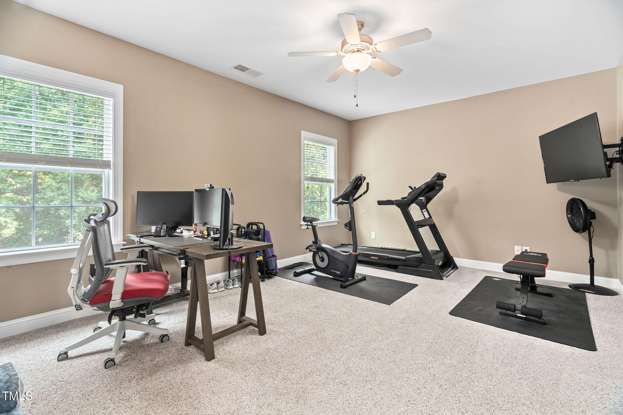 2712 Lake Waccamaw Trail Apex, NC 27502 - Photo 25 of 41 a view of a workspace with furniture and a window