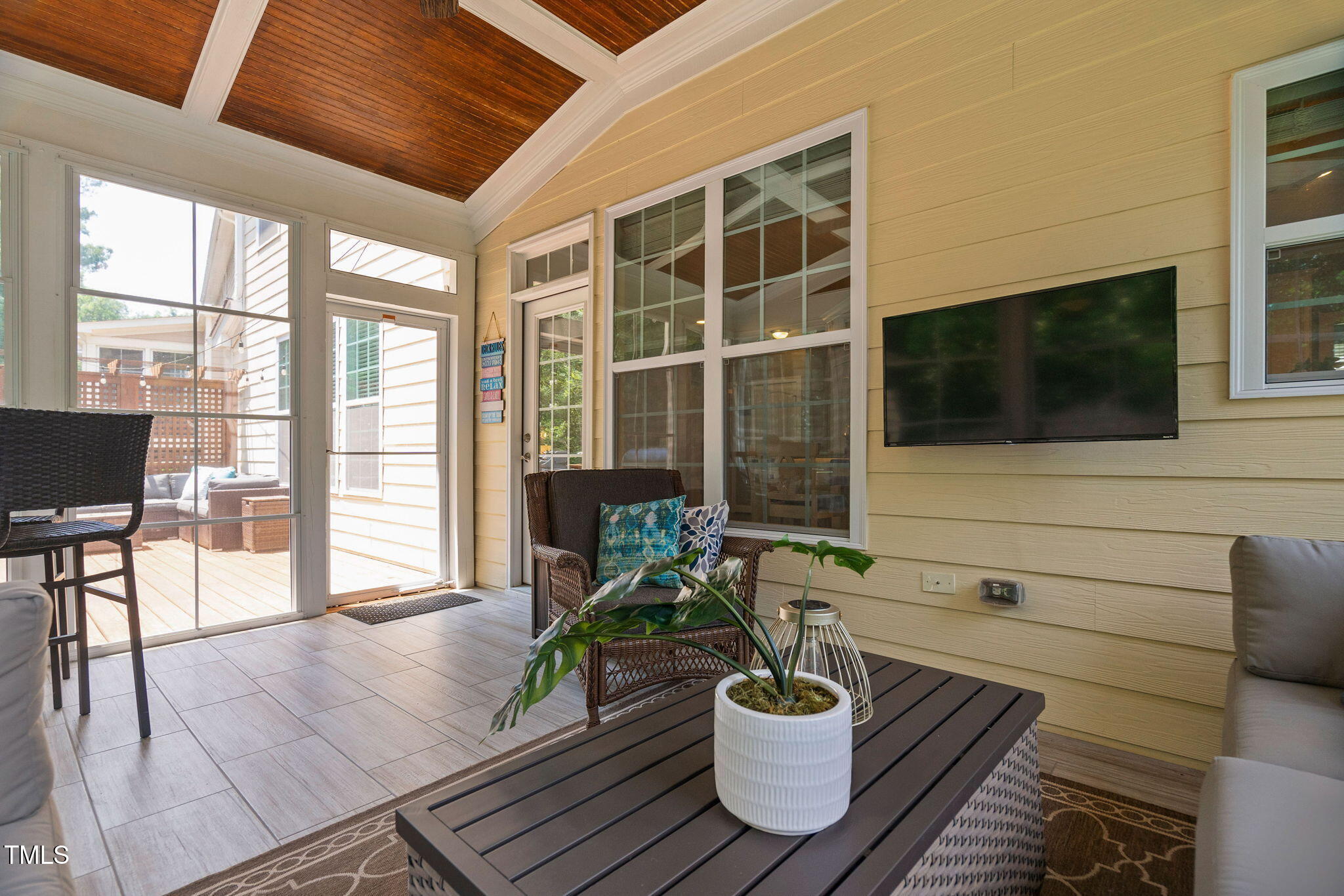 2712 Lake Waccamaw Trail Apex, NC 27502 - Photo 27 of 41 a living room filled with furniture tv and a potted plant