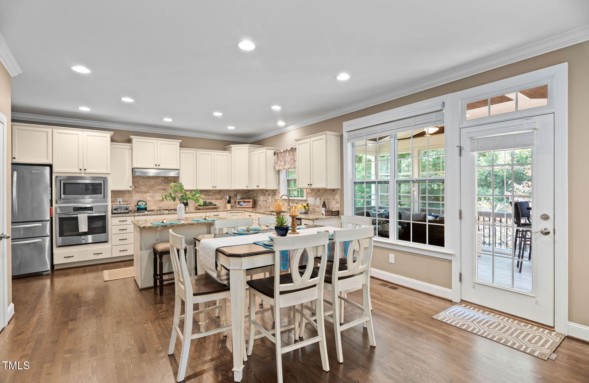 2712 Lake Waccamaw Trail Apex, NC 27502 - Photo 3 of 41 a view of a dining room with furniture window and wooden floor