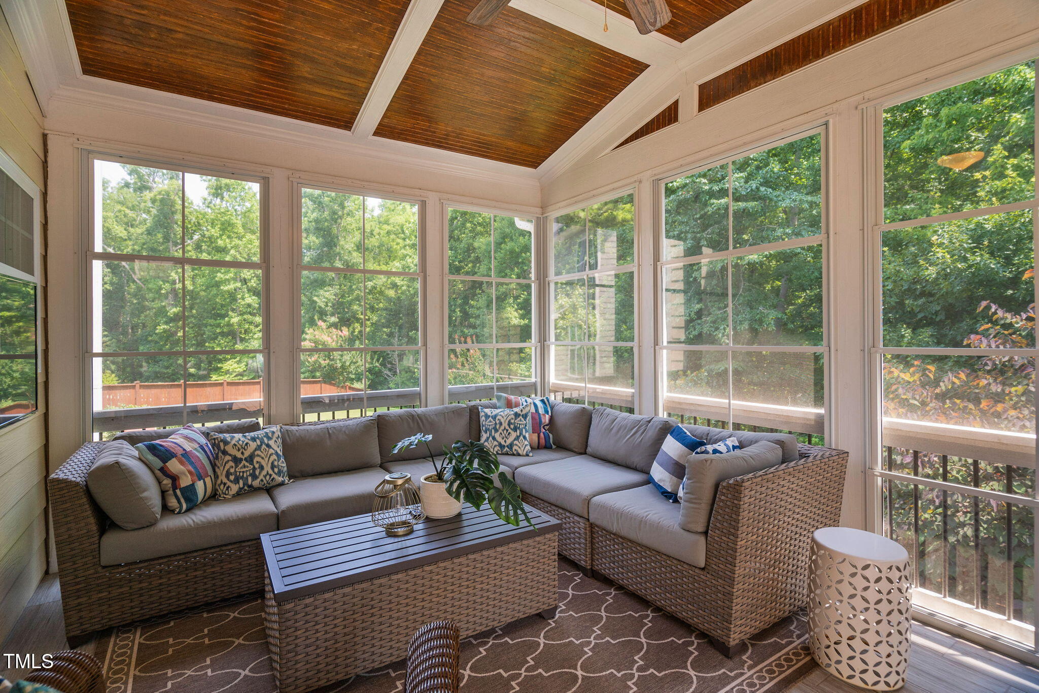 2712 Lake Waccamaw Trail Apex, NC 27502 - Photo 4 of 41 a living room with furniture and floor to ceiling windows