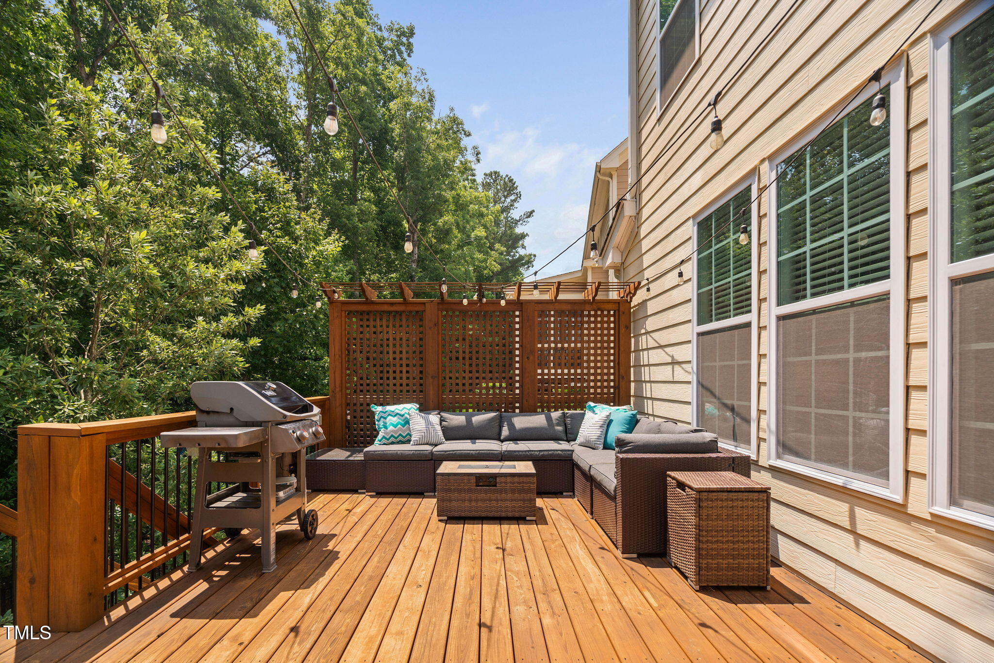 2712 Lake Waccamaw Trail Apex, NC 27502 - Photo 5 of 41 a view of a roof deck with couches and wooden floor
