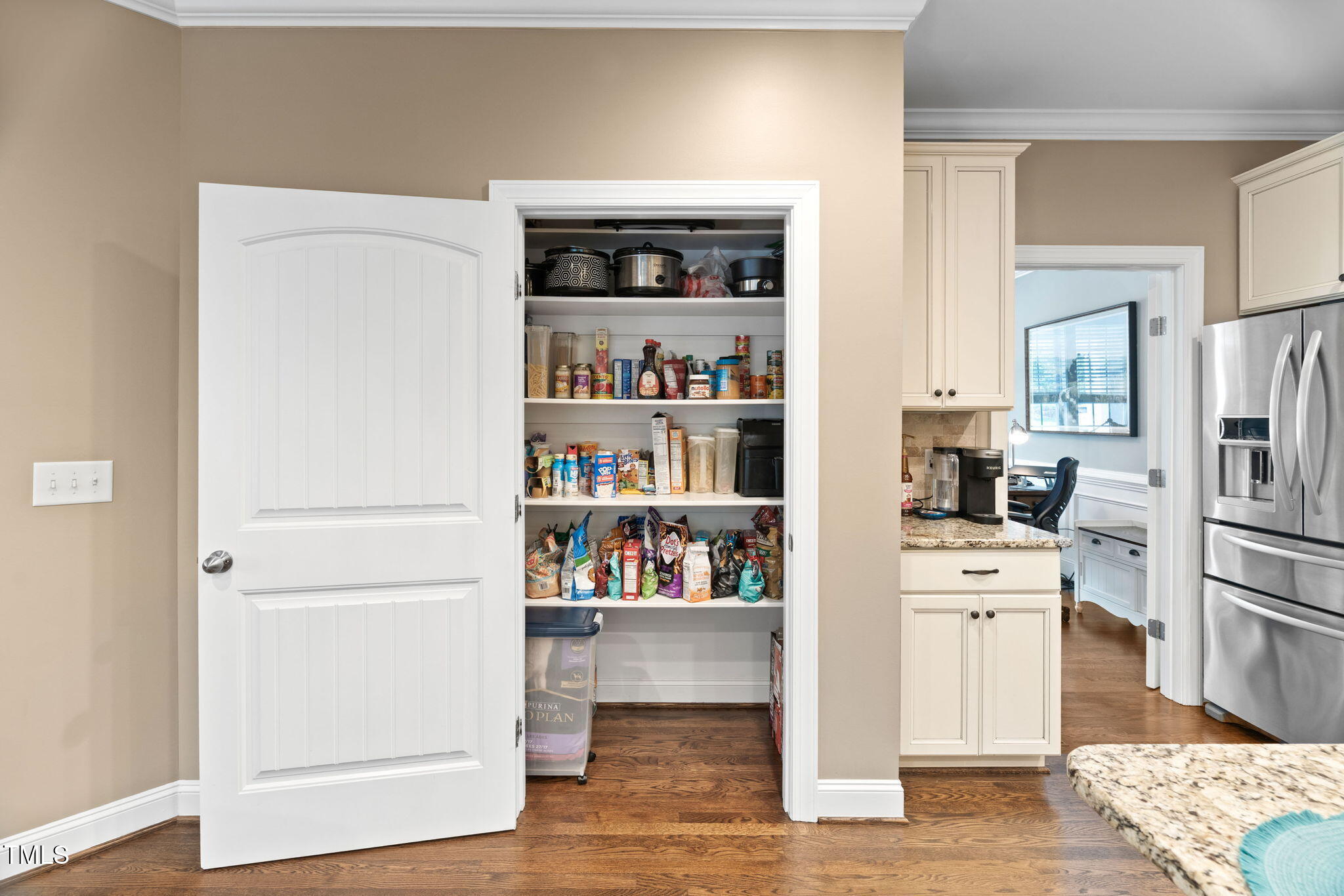 2712 Lake Waccamaw Trail Apex, NC 27502 - Photo 9 of 41 a view of kitchen with cabinets and wooden floor