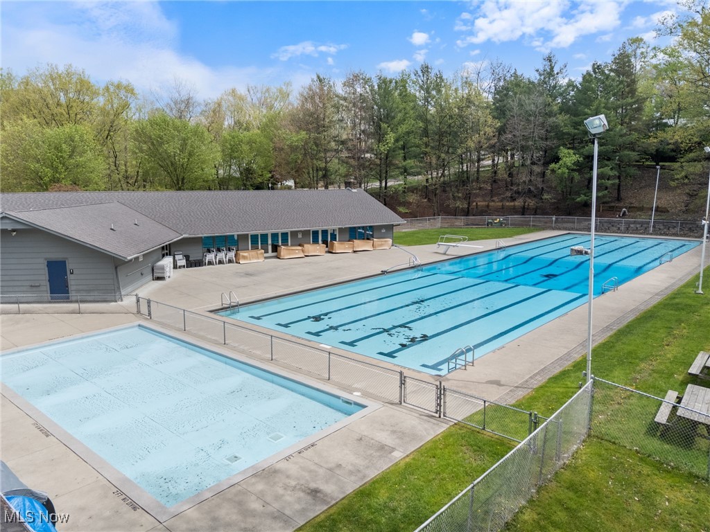 17800 Falling Leaves Road Strongsville, OH 44136 - Photo 2 of 39 Pool featuring a patio area, fence, and a lawn