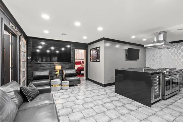 a large bed sitting in a bedroom and a large mirror