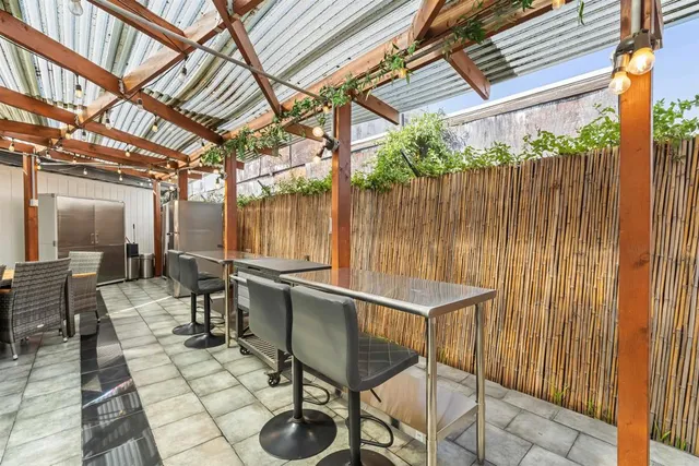 a living room with lots of furniture and white walls