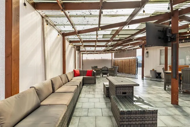 a lobby with furniture and floor to ceiling windows