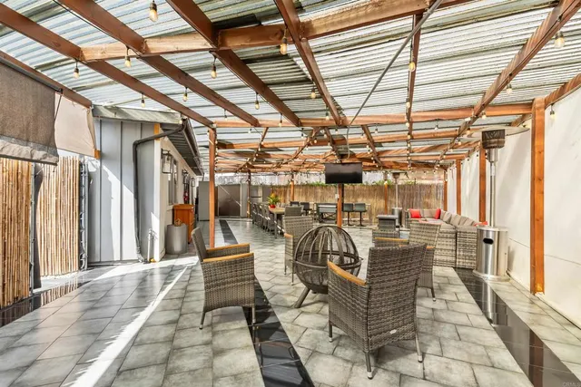 a view of a workspace with furniture